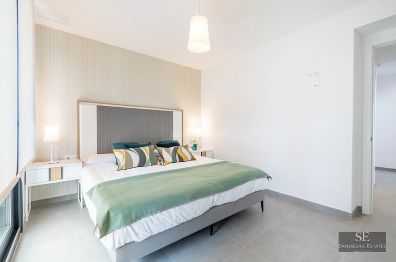 Expansive view of modern villa with infinity pool, wood deck, and lush garden. Minimalist design, elegant architecture.