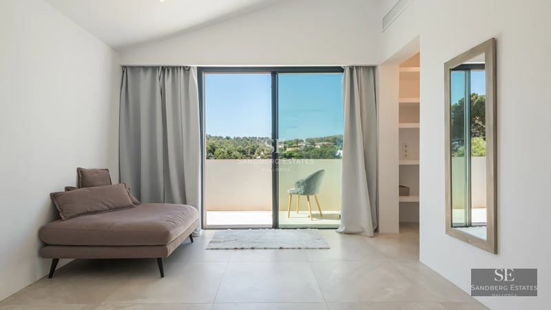Exterior view of a modern villa featuring an infinity pool, expansive terraces, and lush vegetation. Minimalist architectural design.