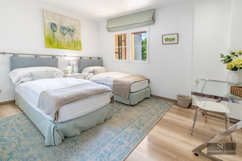 Exterior view of modern villa with reflecting pool. Minimalist design, large windows, and lush greenery.