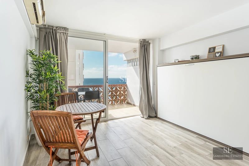 Spacious terrace with pool, sun loungers, and views. Modern design with high-quality materials. Natural lighting.