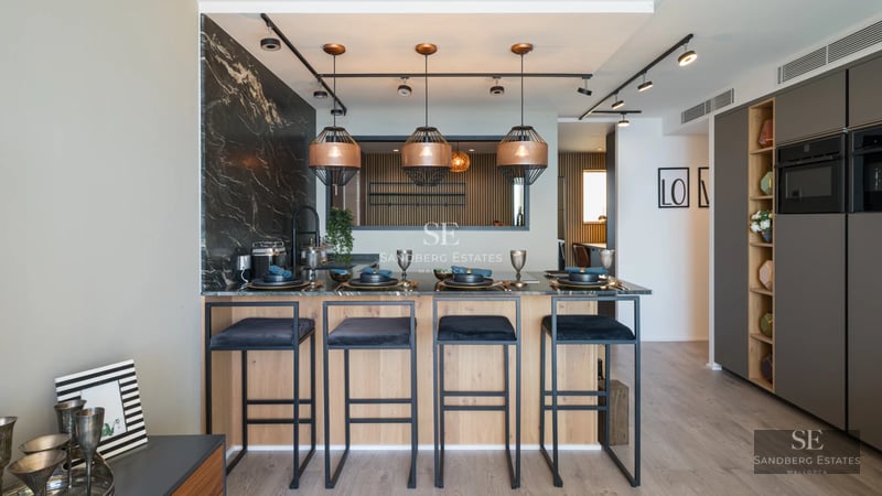 View of pool, terrace, and garden. Modern architecture with large windows and lush greenery. Landscaping design.