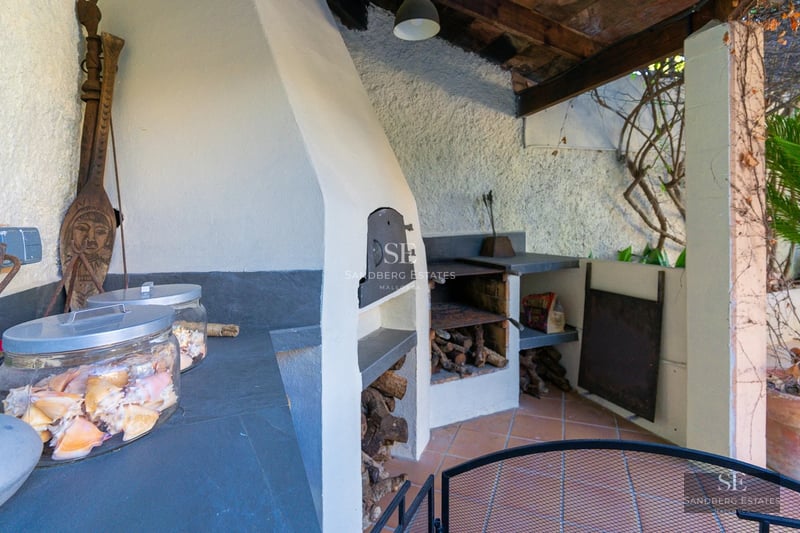 Bright penthouse featuring large windows, minimalist design, and terrace with unobstructed views. Modern and elegant interior.