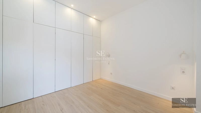 View of infinity pool with lush garden and modern architecture. Elegant interior with natural light and panoramic views.