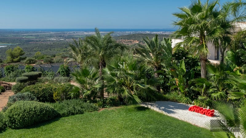 Exterior view of modern villa with infinity pool, lush garden, and spacious terraces. Minimalist architecture and elegant design.