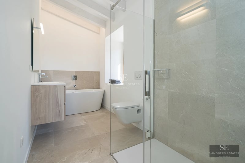 Pool view featuring sun loungers, lawn, modern villa with large windows and blue sky. Minimalist architecture, natural light.