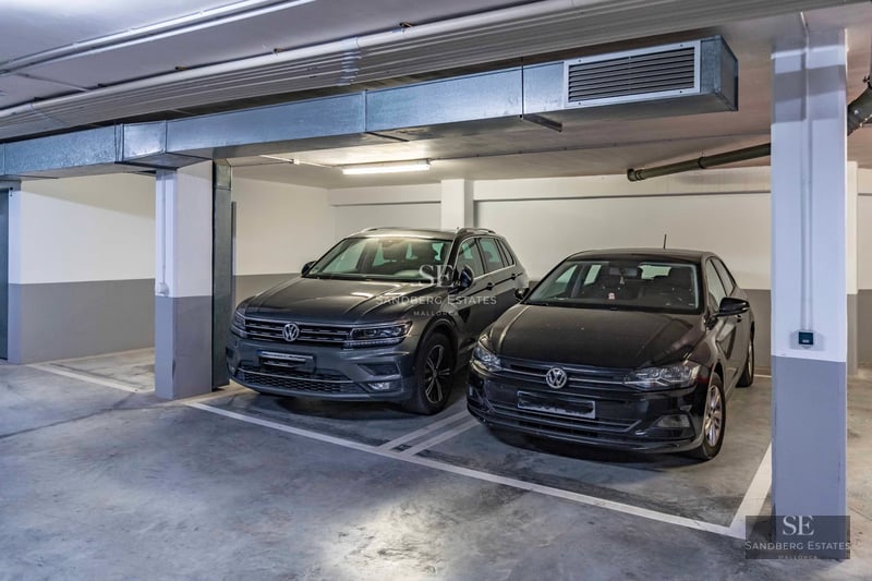 Spacious living room with panoramic sea view windows. Modern design with elegant furniture and abundant natural light.