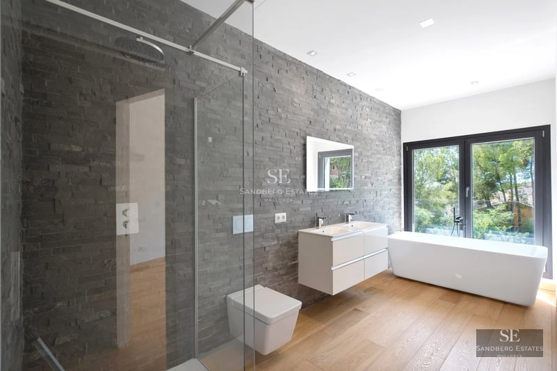 Spacious living room with floor-to-ceiling windows, light wood floors, modern fireplace, and terrace access with panoramic views. Minimalist, elegant design.