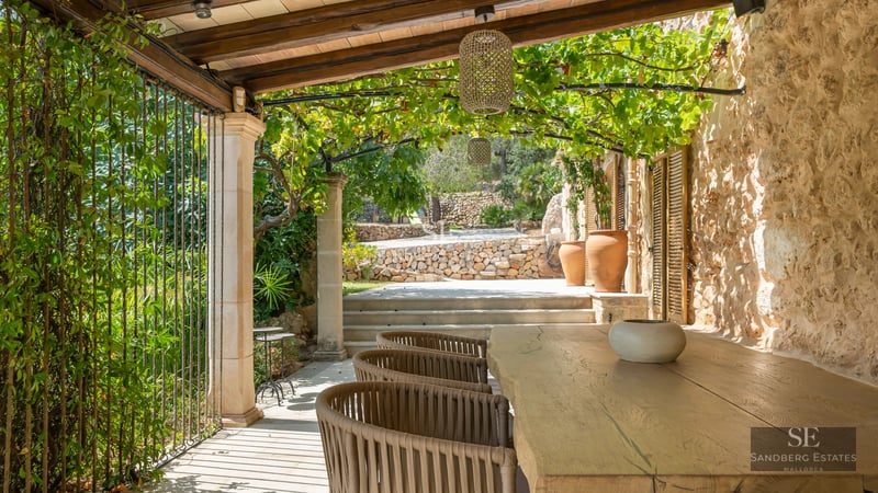 Exterior view of a luxurious residence with infinity pool, lounge chairs, and modern design. Minimalist architecture, blue sky.