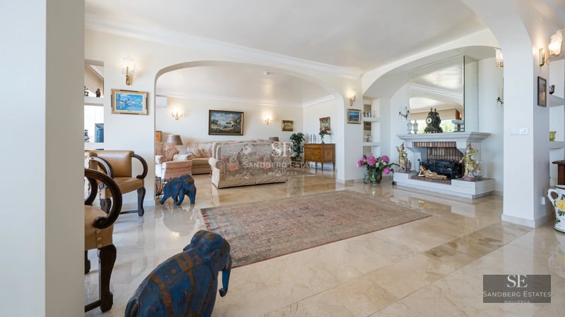 View of a modern villa with reflective pool, clean architecture, and lush landscaping. Warm lighting.
