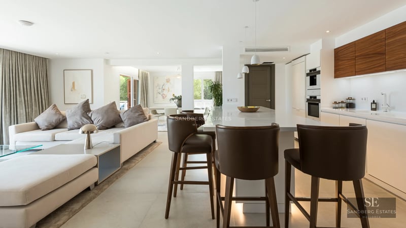 Exterior of modern villa with pool, lush garden, and minimalist architectural design. Ambient lighting and high-end finishes.