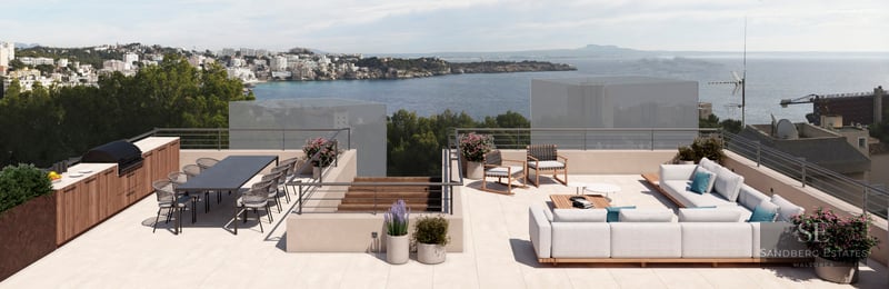 Spacious rooftop terrace with outdoor kitchen, dining area, and lounge seating overlooking the ocean.