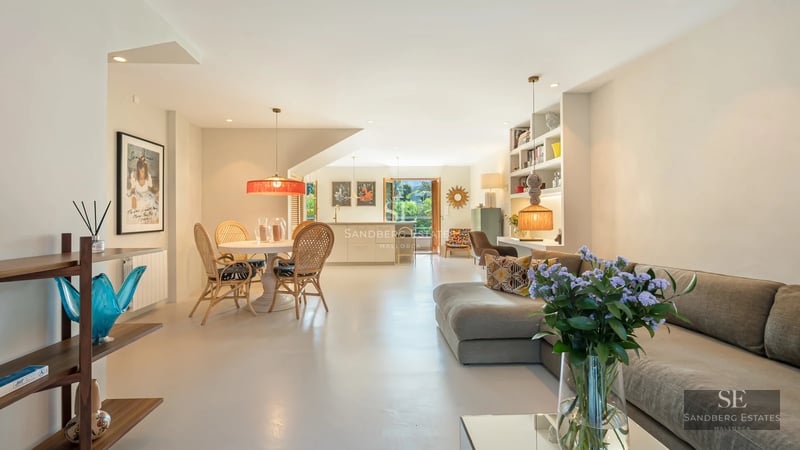 Expansive terrace featuring an infinity pool, panoramic views, modern design furniture, and elegant landscaping.