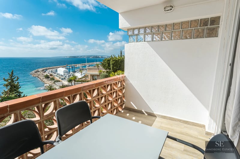 Spacious living room with panoramic views. Minimalist interior, abundant natural light, modern fireplace, and designer furniture.