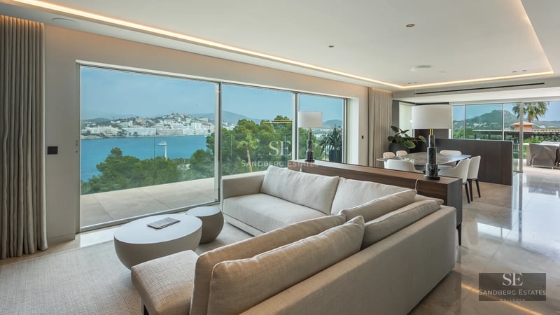 Spacious terrace with infinity pool, panoramic views, modern outdoor furniture, and lush greenery. Minimalist architecture.