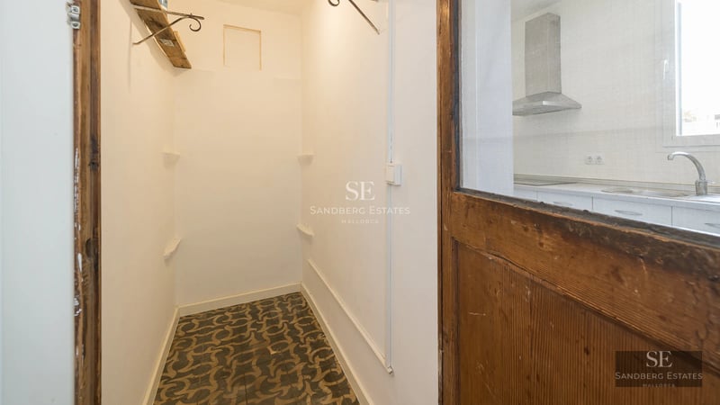 Exterior of a modern villa with reflective pool, manicured garden, and minimalist architecture. Warm lighting and clear sky.