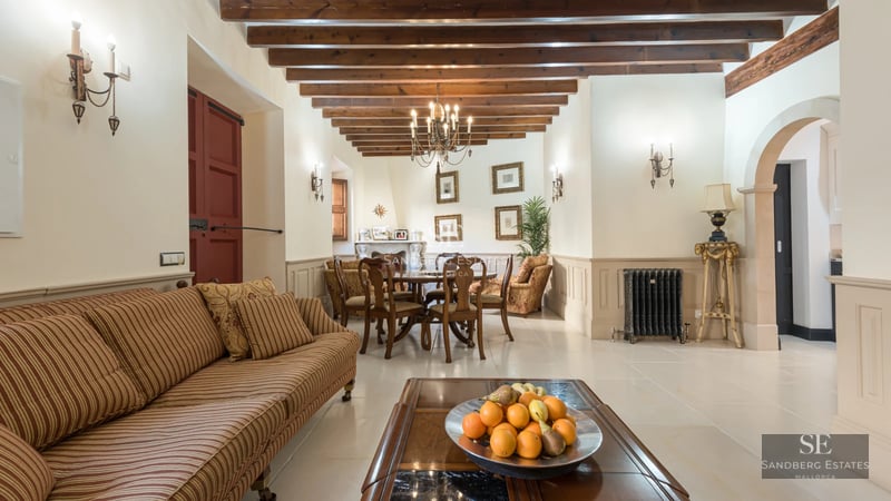 Modern interior featuring a spacious balcony with sea views. Elegant furnishings, light wood floors, and abundant natural light.