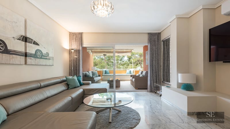 Stunning view of modern villa with infinity pool. Sleek design, spacious terraces, lush gardens, and panoramic views.