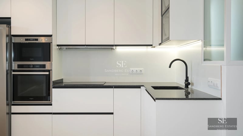 Bright, spacious living room with pool visible through large windows. Modern design, stylish furniture, and pops of color.