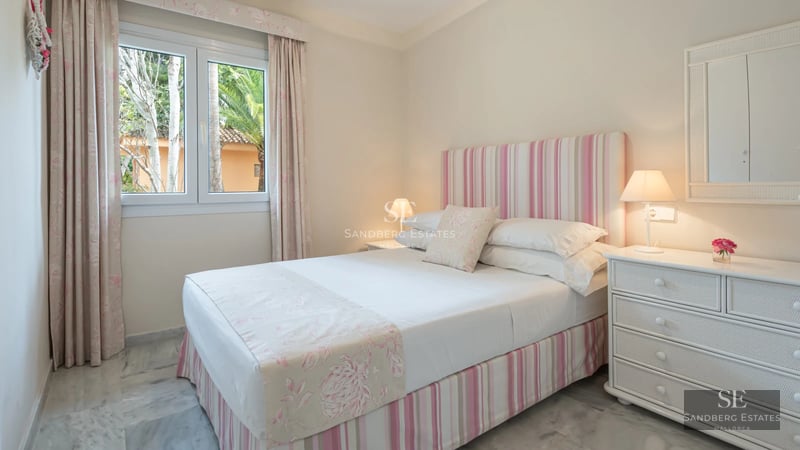 Panoramic view of a modern apartment with balcony and sea views. Minimalist design, luxury finishes.