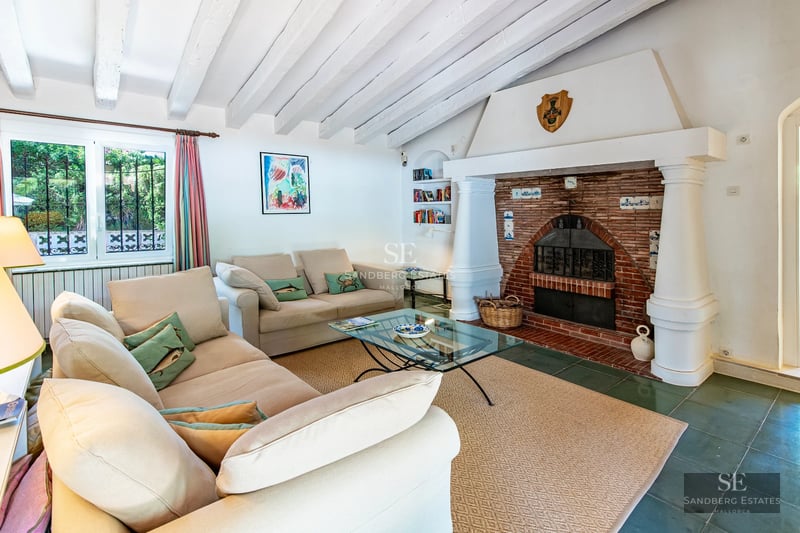 Spacious balcony with panoramic sea views. Modern design, glass railing and outdoor furniture. Luxury and comfort by the ocean.