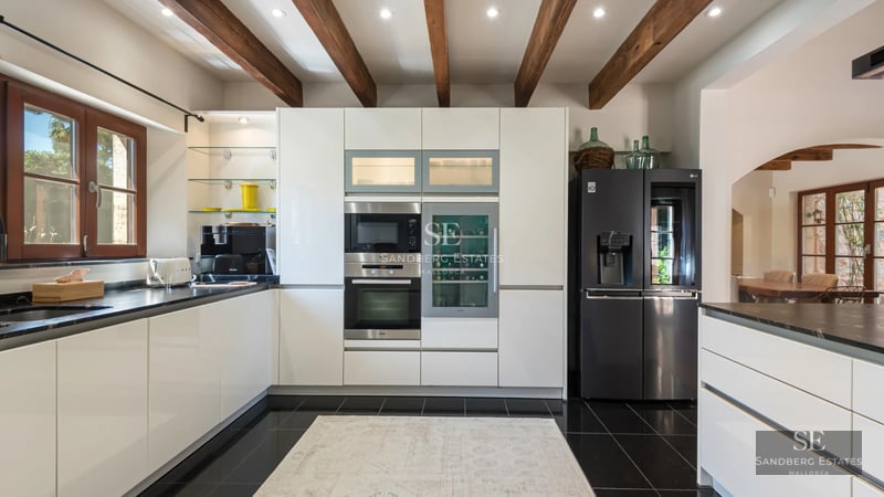 Spacious living room with sea view, balcony, modern furniture, neutral color palette, abundant natural light, and high-quality finishes.