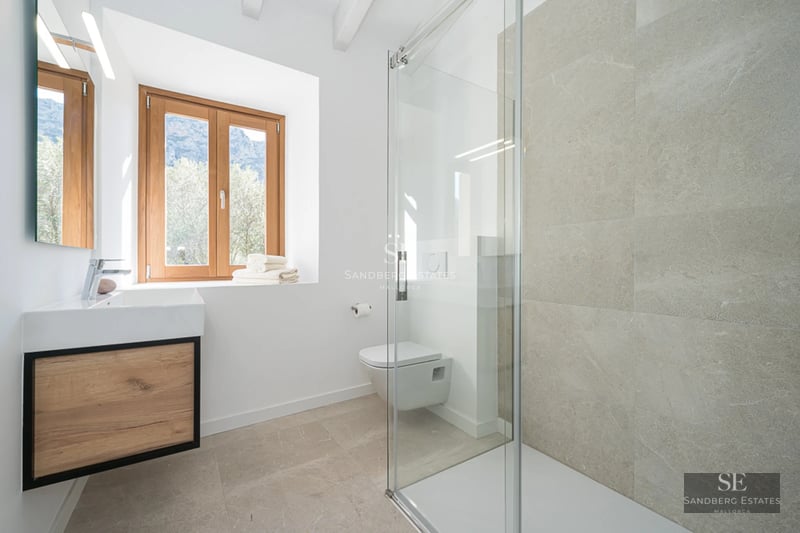 Spacious living room with large windows offering stunning sea views. Modern design with luxury furnishings.