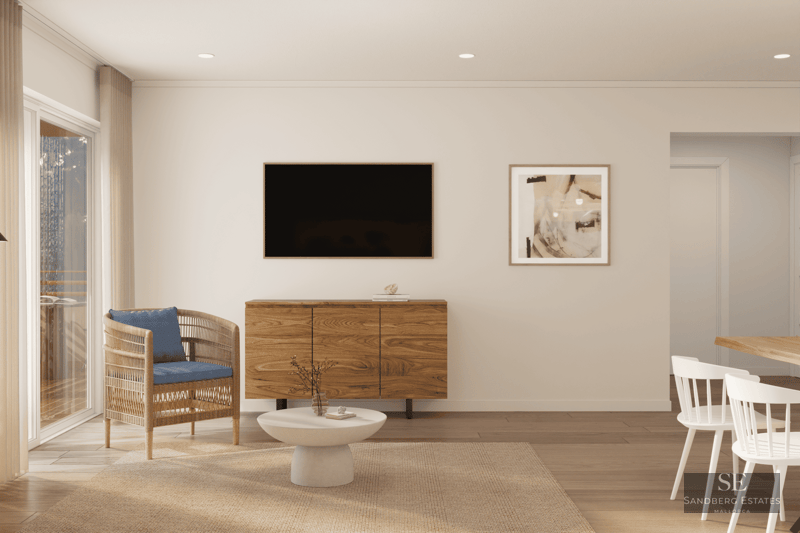 Salon moderne avec buffet en bois, TV, fauteuil en osier avec coussin bleu et coin repas lumineux.