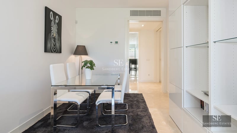 Expansive outdoor area with pool, seating area and lush greenery. Modern and relaxing design for enjoying the outdoors.