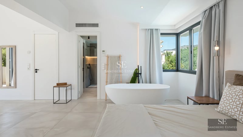 Exterior view of a modern villa featuring an infinity pool, lush garden, and minimalist architecture. Ambient lighting and landscaping.