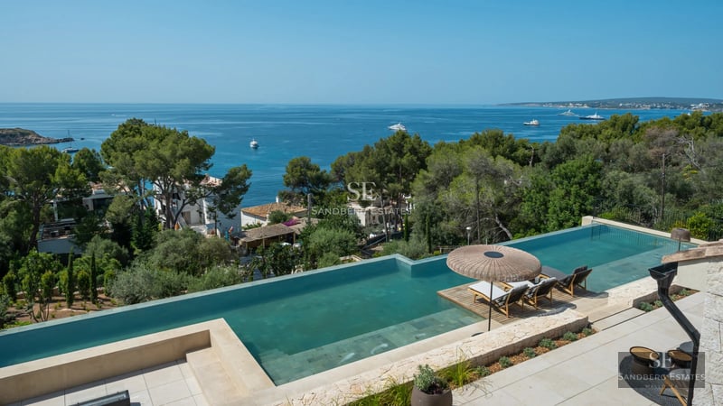 View of a stylish villa with a private pool. Modern design, large windows, and lush greenery. Luxurious outdoor space.