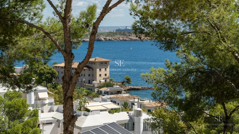 Exterior view of modern villa with infinity pool, expansive terraces, and lush gardens. Sleek and minimalist architectural design.