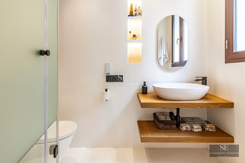 View of a modern villa with a pool. Sleek design, clean lines, and large windows. Natural lighting and lush landscaping.