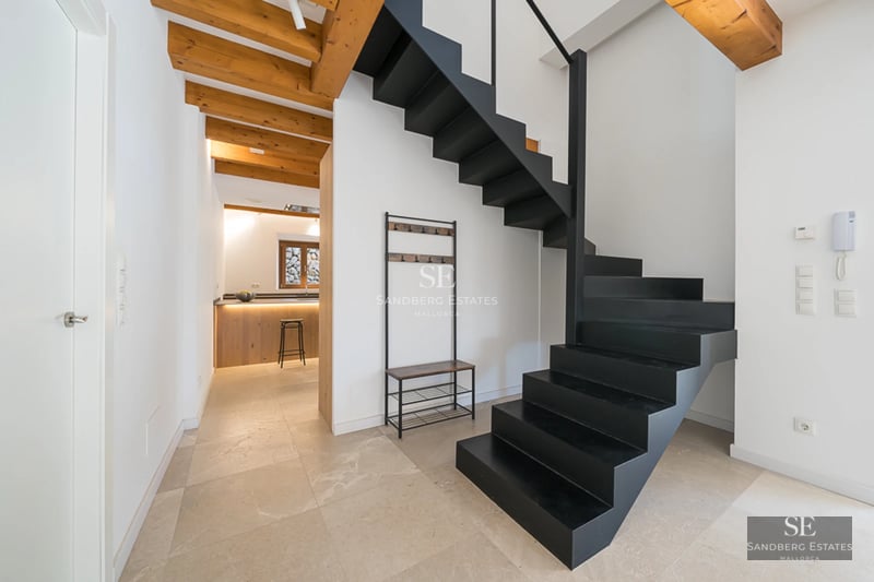 Exterior of a modern villa featuring a reflective pool. Minimalist architecture, large windows, and lush landscaping.
