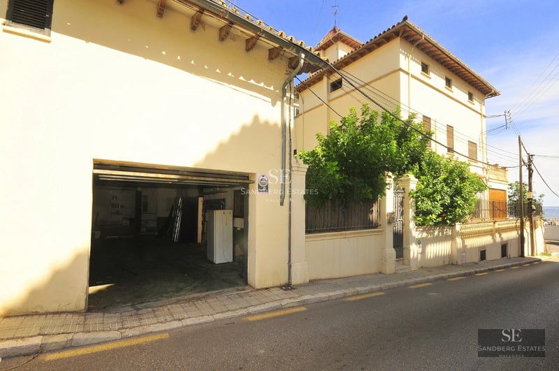 Exterior view of a modern villa with infinity pool, lush garden, and minimalist architecture. Warm ambient lighting.