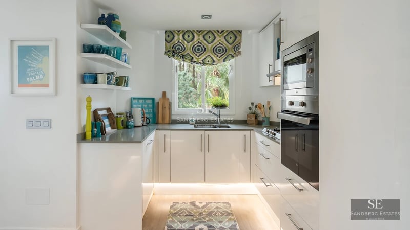 Exterior view of a modern villa with infinity pool, lush gardens, and expansive terraces. Minimalist architectural design.