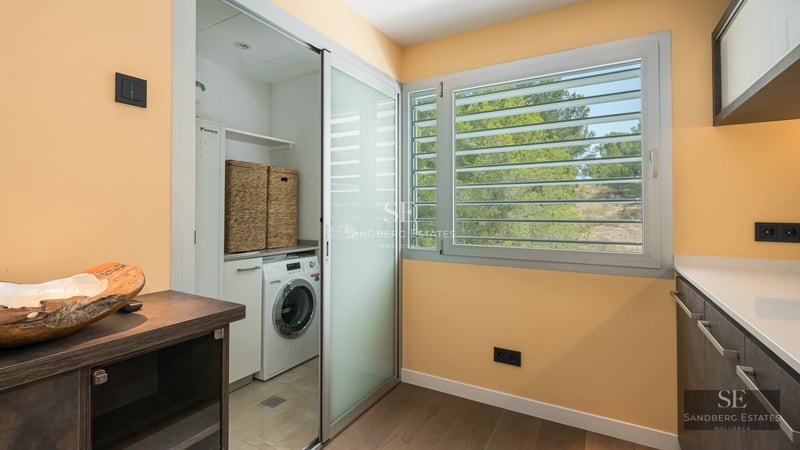 Spacious terrace with pool, sun loungers, and panoramic views. Modern design with wood and greenery accents. Natural lighting.