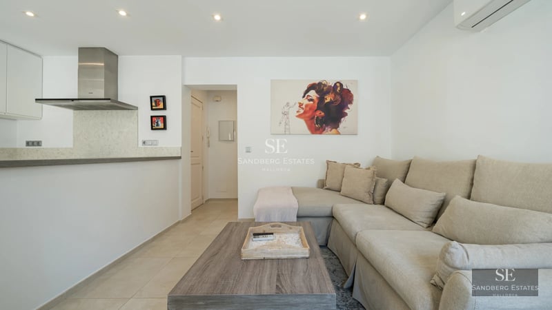 Spacious terrace featuring a pool, sun loungers, and panoramic views. Modern design with glass railing and stylish outdoor furniture.