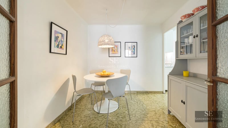 Exterior of modern villa featuring an infinity pool and ocean view. Clean architecture, large windows, and lush garden.
