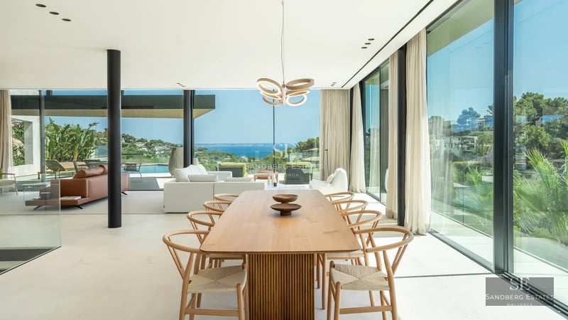 Pool view with lush garden and modern architecture. Open spaces, natural light, and sophisticated design.
