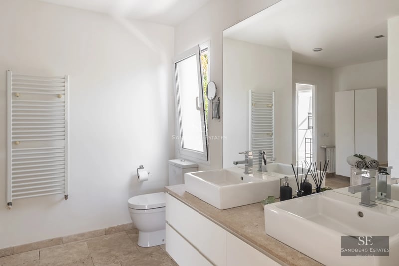 Spacious living room with large windows, panoramic sea views, and balcony access. Modern design, natural light, and high-quality finishes.