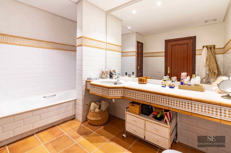 View of property with pool, modern design, spacious terrace, and lush garden. Ideal for families and entertaining.