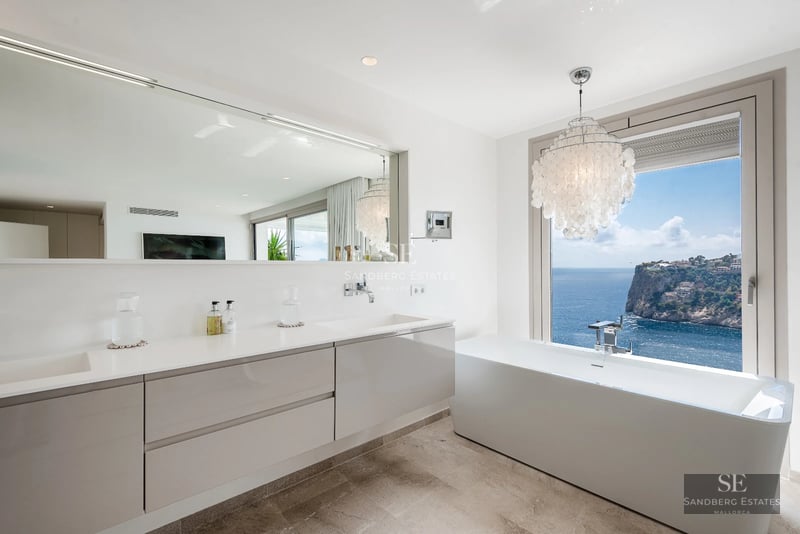 Exterior view of a modern villa with a pool. Minimalist architecture, large windows, and manicured landscaping. Ambient lighting.