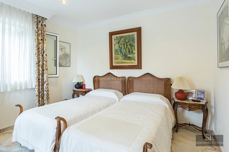 View of shimmering infinity pool. Lush garden and modern architecture. Ideal for luxury living.