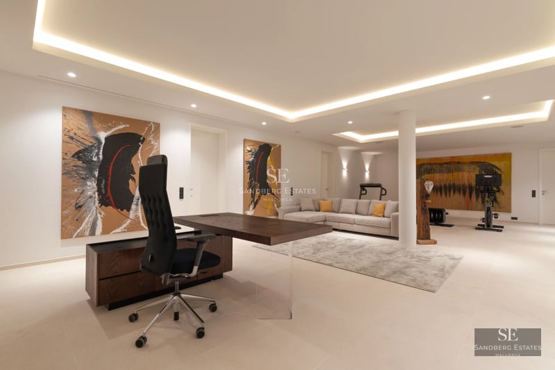 Aerial view of modern villa with infinity pool, lush garden & minimalist architecture. Spacious terraces & panoramic views.