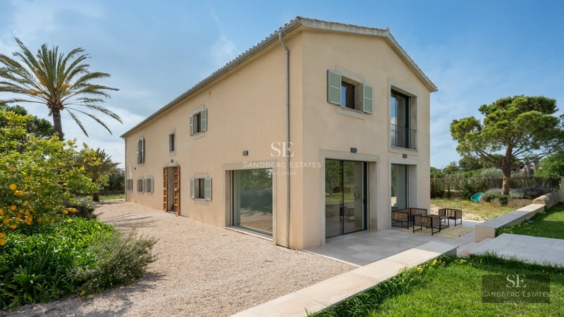 Spacious living room with pool, designer sofas, modern lighting, and floor-to-ceiling windows offering panoramic views. High-end finishes.