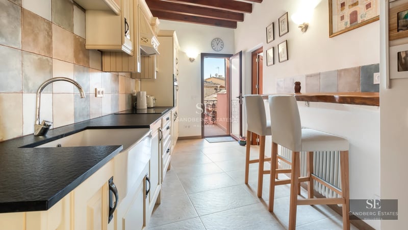 Bright living room with large windows, a modern fireplace, and elegant décor. Spacious sofas, designer coffee table, and soft rug.