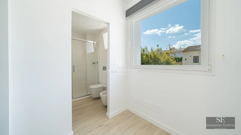 Exterior view of a modern villa with a pool, lush garden, and minimalist architecture. Large windows and high-quality finishes.