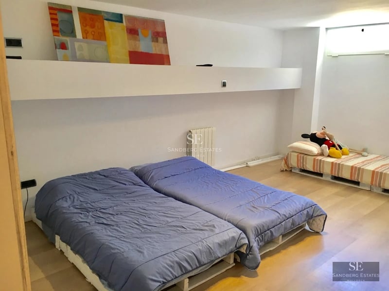 View of a modern villa with a pool and landscaped garden. Minimalist design, large windows, and high-quality finishes.