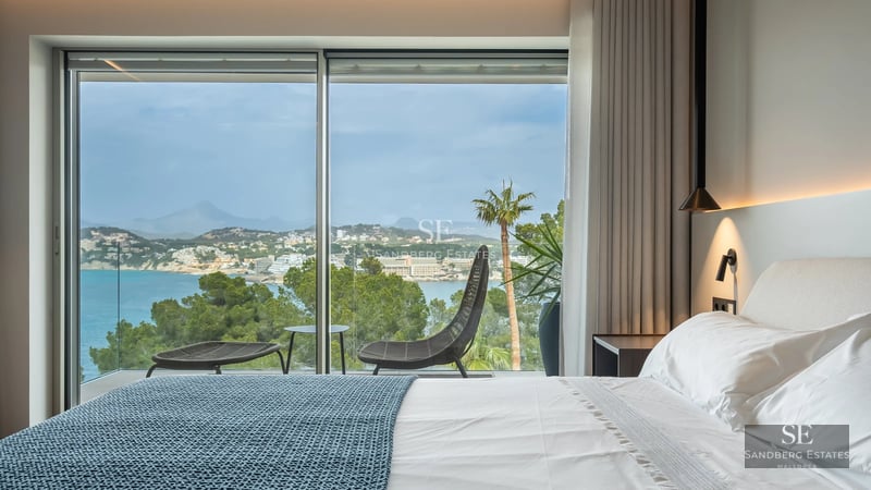 Pool view with terrace, lawn and modern architecture. Natural lighting and minimalist design.