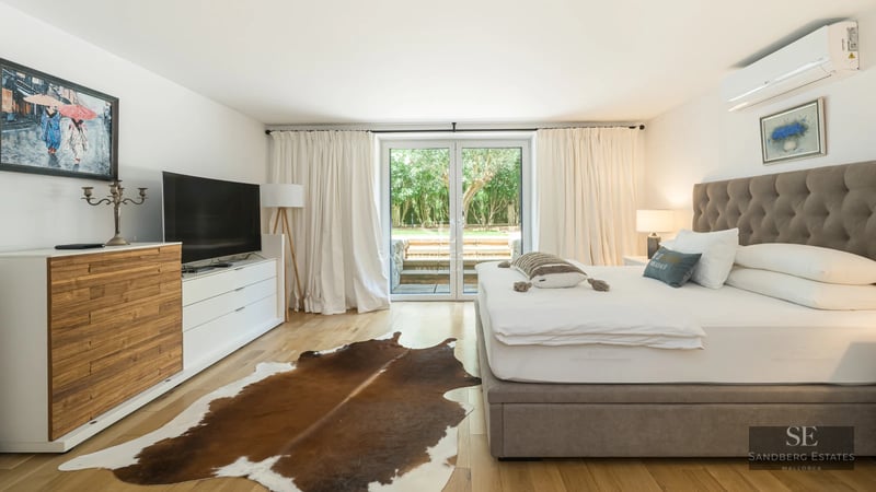 Modern penthouse with large windows, balcony with sea view and minimalist design. Bright and elegant interiors. High-end furniture.